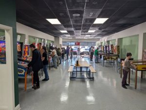 Visitors to the Greensboro Pinball Machine Museum try out the pinball machines on opening day.